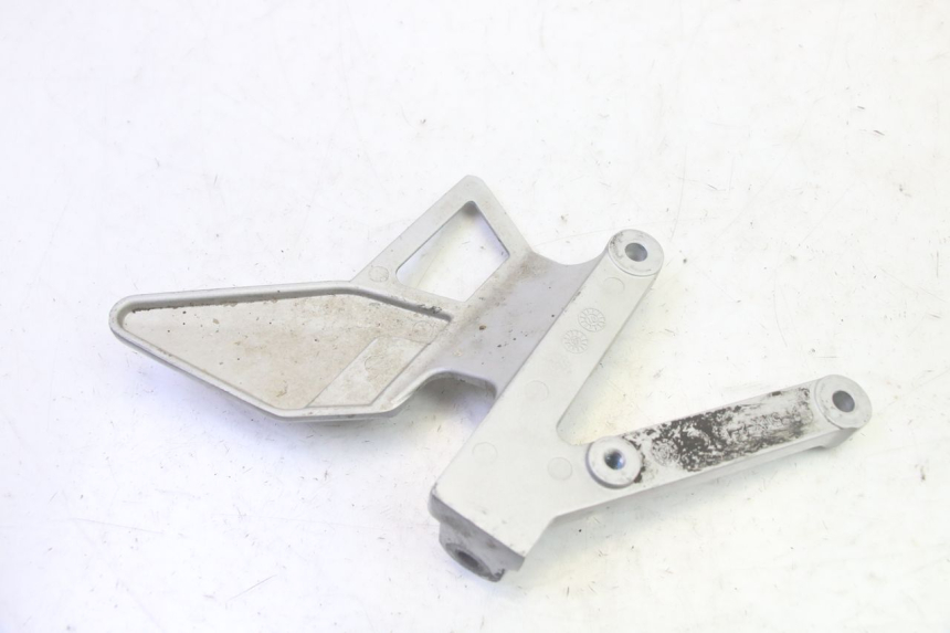 photo de PLATINE CALE PIED AVANT GAUCHE YAMAHA TZR 50 (2008 - 2016) - Zoom état d’usage